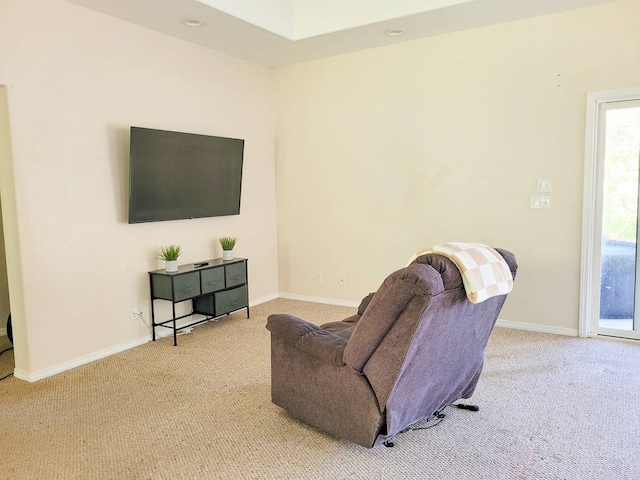 living room featuring light carpet