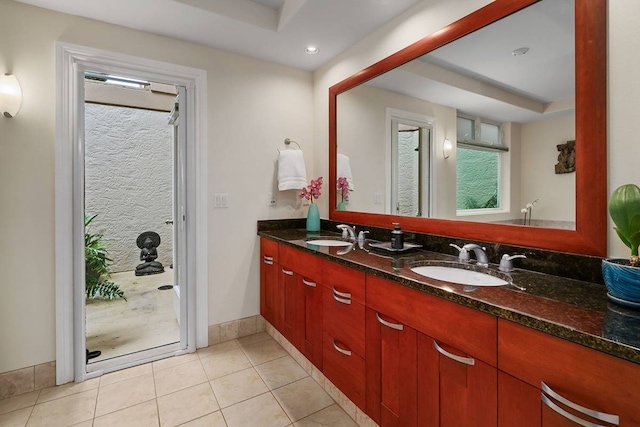 bathroom with tile floors and double vanity