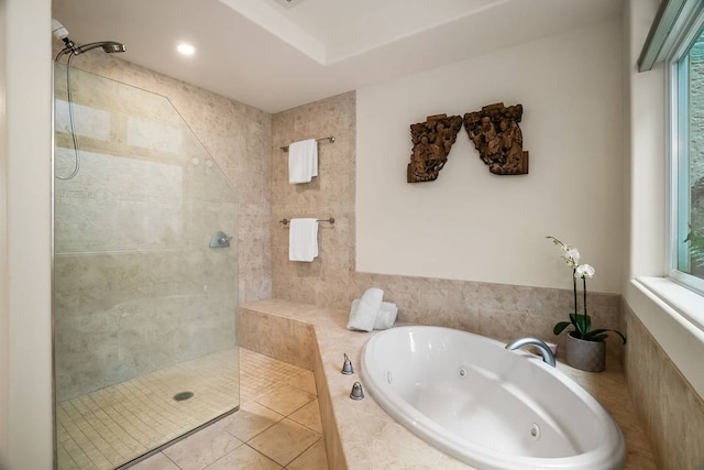 bathroom with tile floors and separate shower and tub