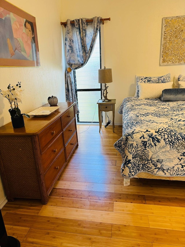 bedroom featuring light wood-type flooring