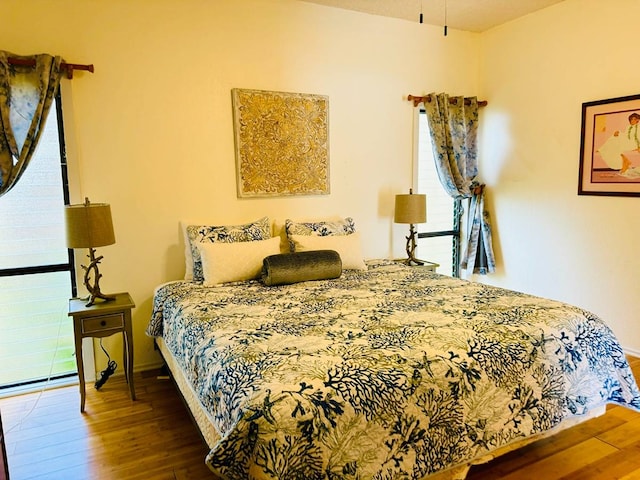 bedroom featuring dark hardwood / wood-style floors