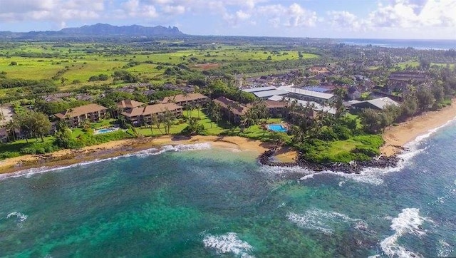 drone / aerial view featuring a view of the beach and a water view