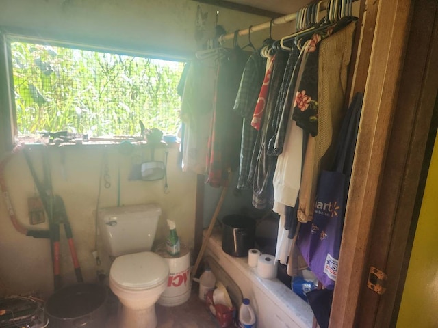 bathroom with curtained shower and toilet