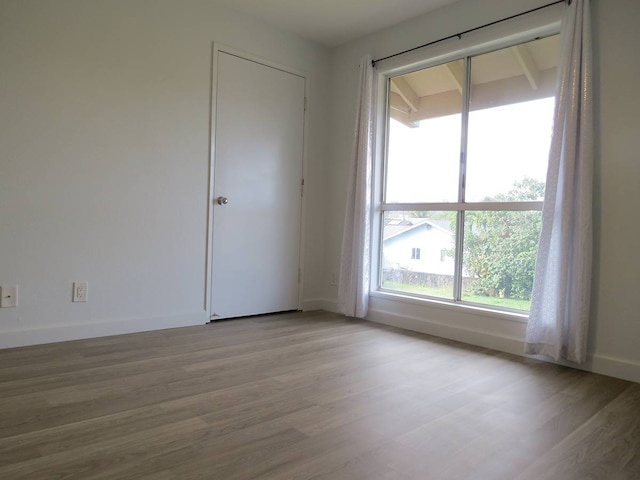 spare room featuring light wood-type flooring