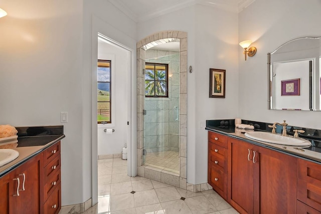 bathroom with vanity, tile flooring, a shower with shower door, and ornamental molding