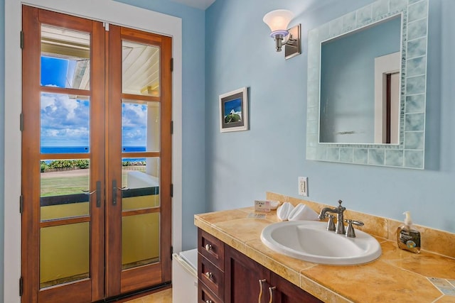 bathroom with vanity and french doors