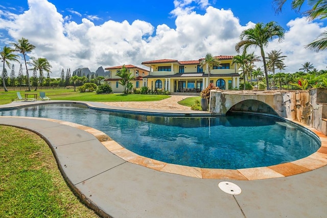 view of pool featuring a yard