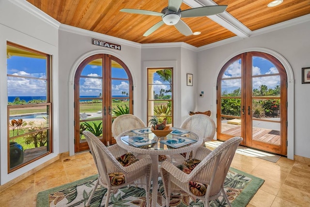 tiled dining area featuring wood ceiling, plenty of natural light, ceiling fan, and french doors