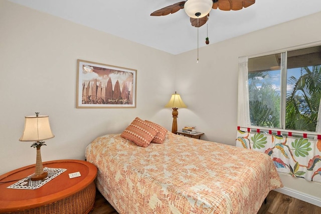 bedroom featuring dark wood-type flooring and ceiling fan