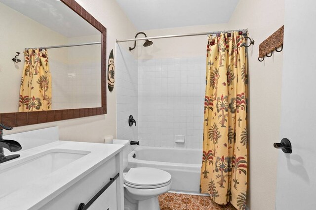 full bathroom featuring oversized vanity, toilet, and shower / bath combo