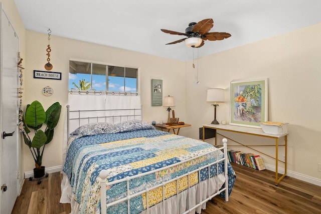 bedroom featuring ceiling fan and dark hardwood / wood-style flooring