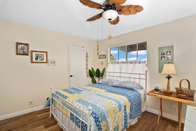 bedroom featuring ceiling fan and dark hardwood / wood-style floors