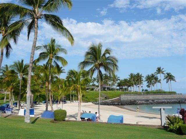 surrounding community featuring a lawn and a water view