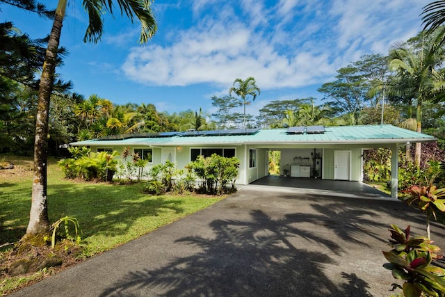 single story home featuring a front lawn and a carport