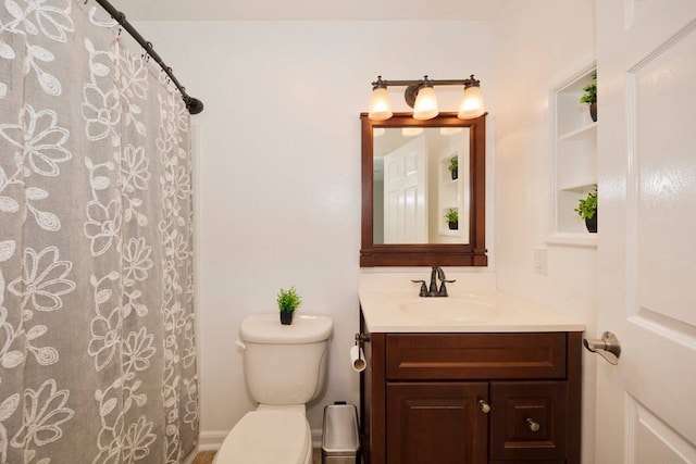 bathroom with toilet and vanity