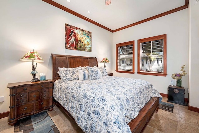 bedroom with dark tile flooring and crown molding