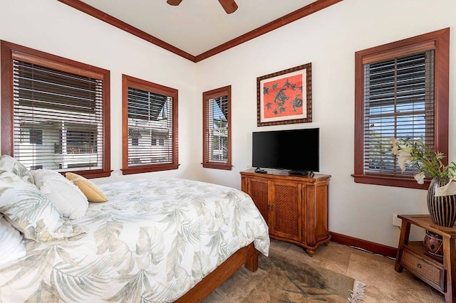 tiled bedroom featuring ornamental molding, ceiling fan, and multiple windows