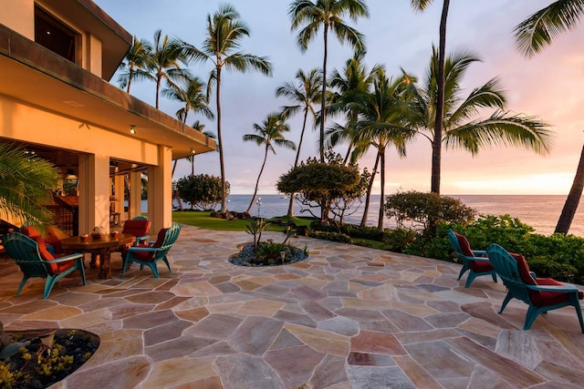 patio terrace at dusk with a water view