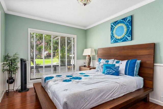 bedroom with dark hardwood / wood-style floors and crown molding