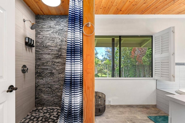 bathroom with curtained shower and wood ceiling