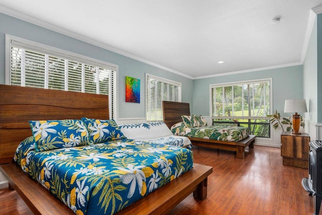 bedroom featuring dark hardwood / wood-style flooring and ornamental molding