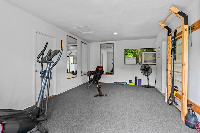 workout room with dark colored carpet