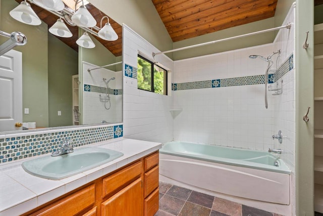 bathroom with vanity, tile floors, tiled shower / bath, vaulted ceiling, and wooden ceiling