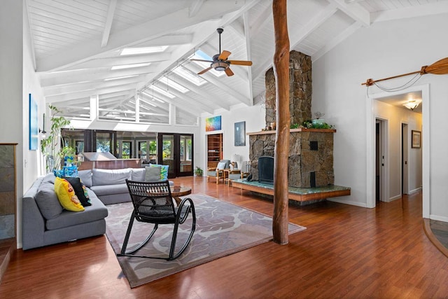 living room with high vaulted ceiling, a fireplace, beamed ceiling, and dark wood-type flooring