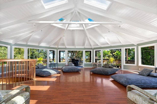 sunroom / solarium with lofted ceiling with skylight