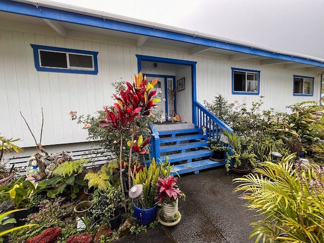 view of exterior entry with covered porch