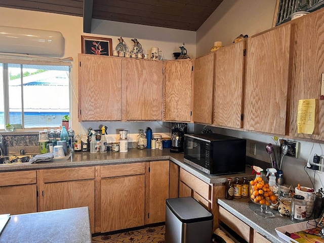 kitchen with a water view and sink