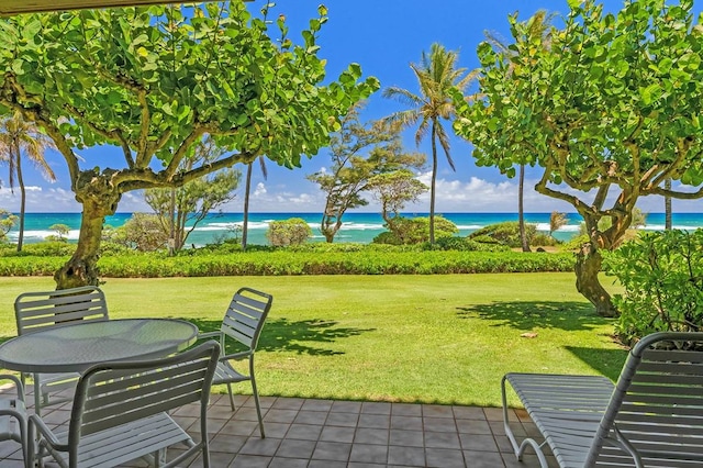 view of terrace with a water view