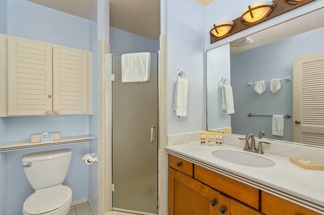 bathroom with tile floors, walk in shower, toilet, and vanity