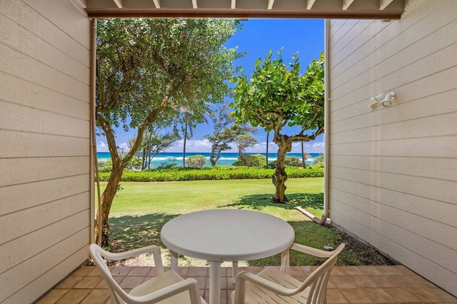 view of terrace with a water view