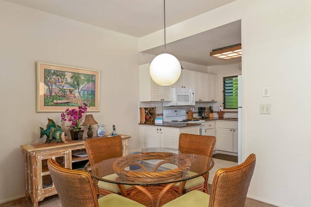 dining area with carpet floors