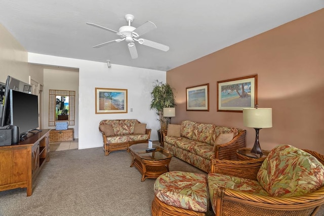 carpeted living room featuring ceiling fan