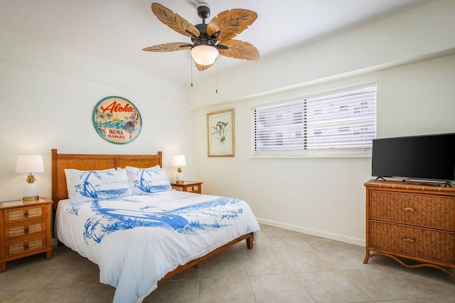 tiled bedroom with ceiling fan