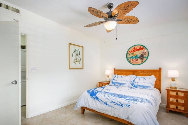 tiled bedroom featuring ceiling fan