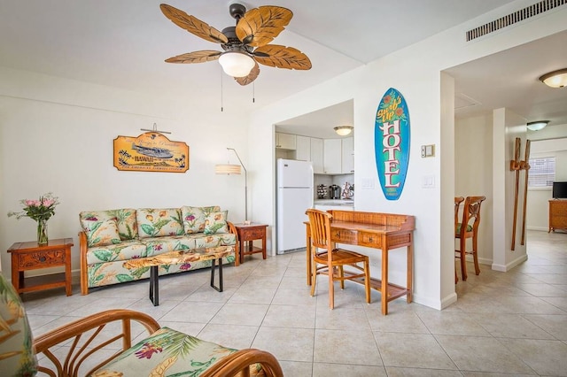 living room featuring ceiling fan and light tile flooring