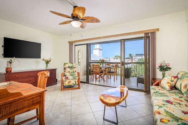 tiled living room with ceiling fan