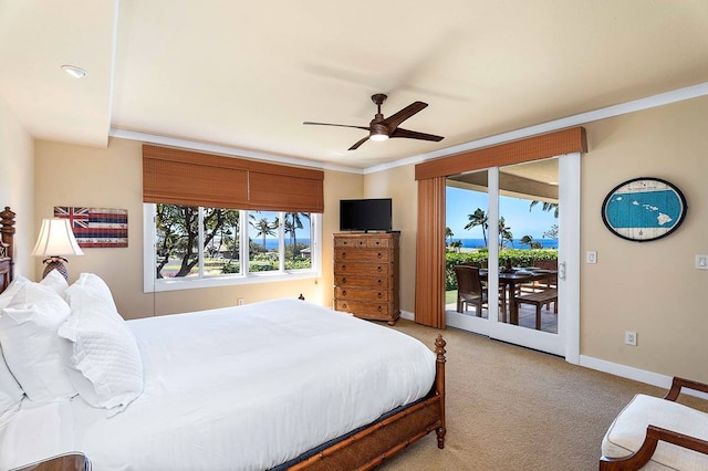 bedroom featuring ceiling fan, access to exterior, light colored carpet, and crown molding