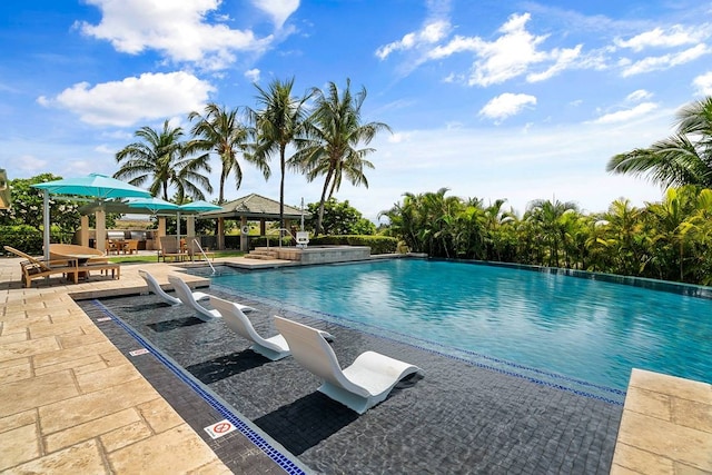 view of pool featuring a gazebo and a patio area