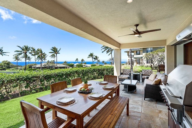 view of patio featuring an outdoor living space, a water view, and ceiling fan