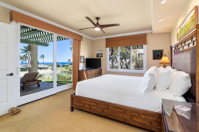 carpeted bedroom featuring access to outside, multiple windows, and ceiling fan