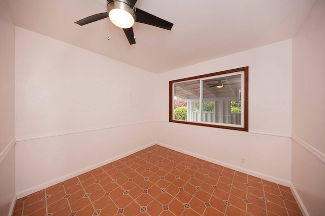 tiled empty room with ceiling fan