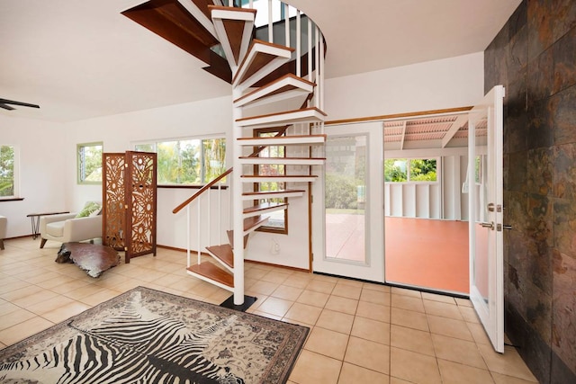 tiled foyer with a healthy amount of sunlight