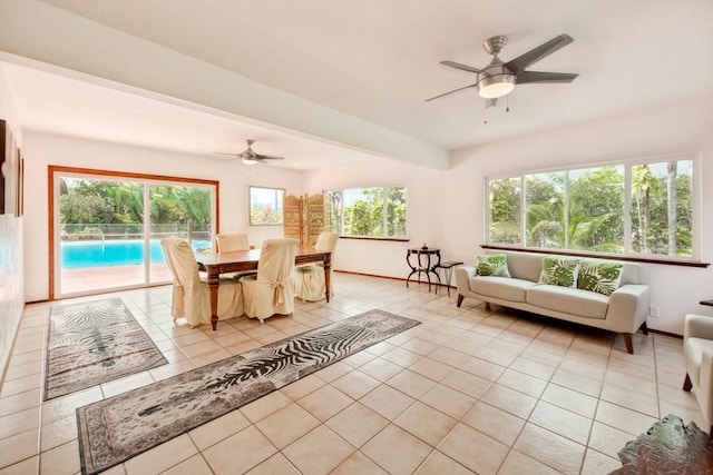 tiled dining area with ceiling fan