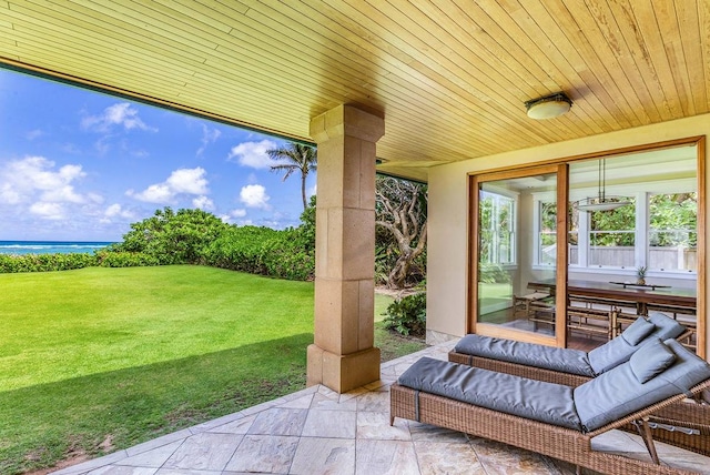 view of patio with a water view