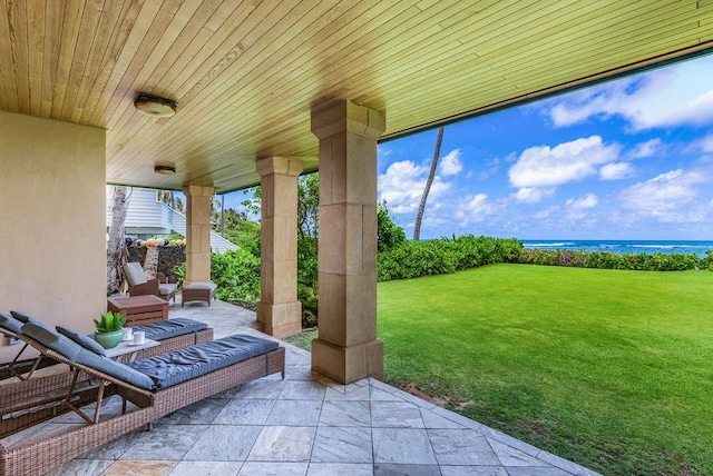 exterior space with a water view and a patio area