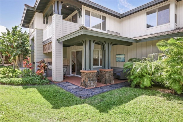 rear view of house with a yard